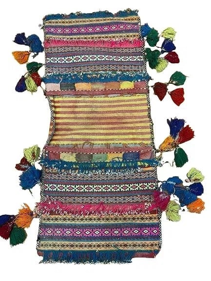 A Balouch hand woven Saddle bag: An old Afghan Balouch hand woven Saddle bag measuring 34 inches long by 15 inches long.
