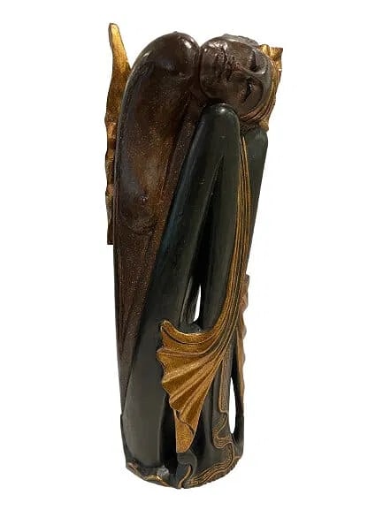 A hand Carved Wood Balinese statue: A hand Carved Wood Balinese statue measuring 15 inches tall by 5 inches wide.