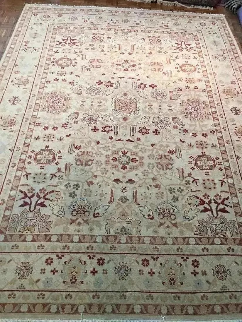 A handwoven Pakistan wool rug: A hand woven Pakistan wool rug measuring 8 feet 10 inches wide by 11 feet 11 inches long.