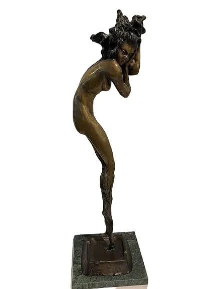 A bronze tall Louis Icart statue of a nude female figure: A bronze tall Louis Icart statue of a nude female figure standing 24 inches tall with a 5 inch by 6 inch marble base.