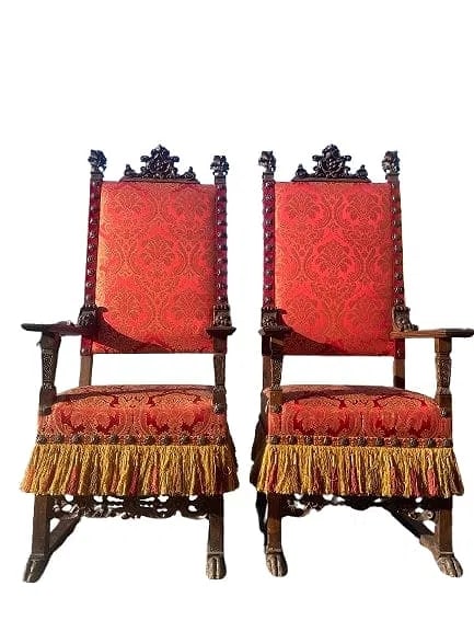 Important Pair of Antique Scottish throne chairs: Important Pair of late 18th century European Scottish throne chairs with ornate celtic carvings. A rare set of large Scottish walnut chairs with wide plank arm rest with Fleur de Lis carved crowns. Th