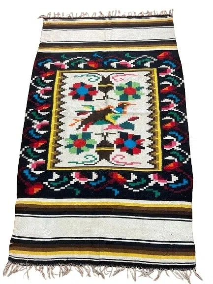 A Tribal Blanket flat woven wool rug: A Tribal Blanket flat woven wool rug 4 feet 1 inches by 6 feet 8 inches long. A vivid colorful blank rug.