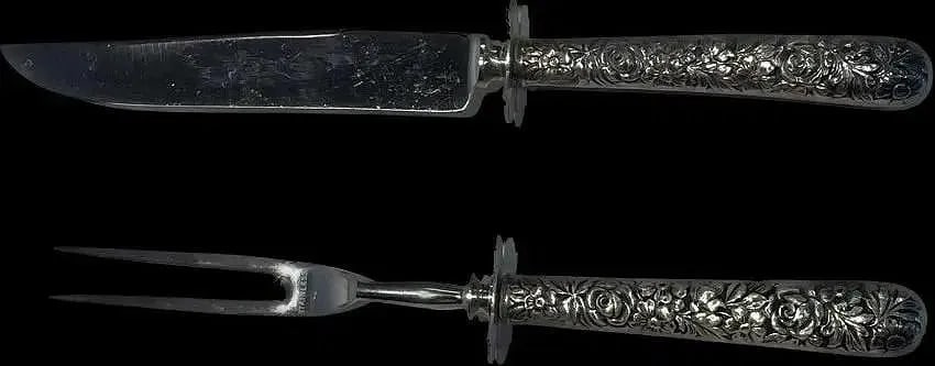 Sterling silver Handle Carving Set: Sterling silver Handle Carving Set. A sterling handle Knife & Fork. Very detailed floral pattern chasing with Stainless steel blade.