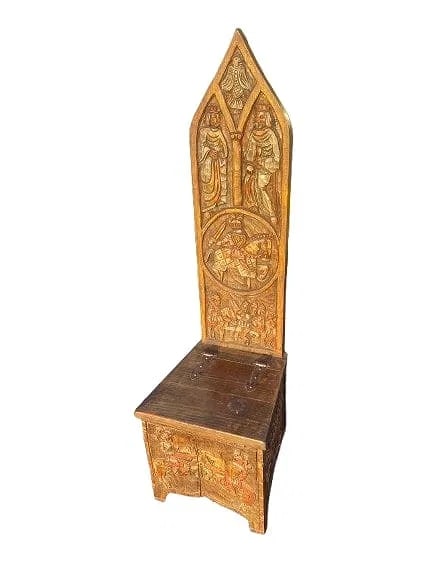 Antique European carved Gothic storage chair: Antique European carved Gothic chair with a two hinged storage. Measuring 57 inches tall, 17 inches wide and 17 inches seat height. A unique chair with lots of figures carved and has a small secret
