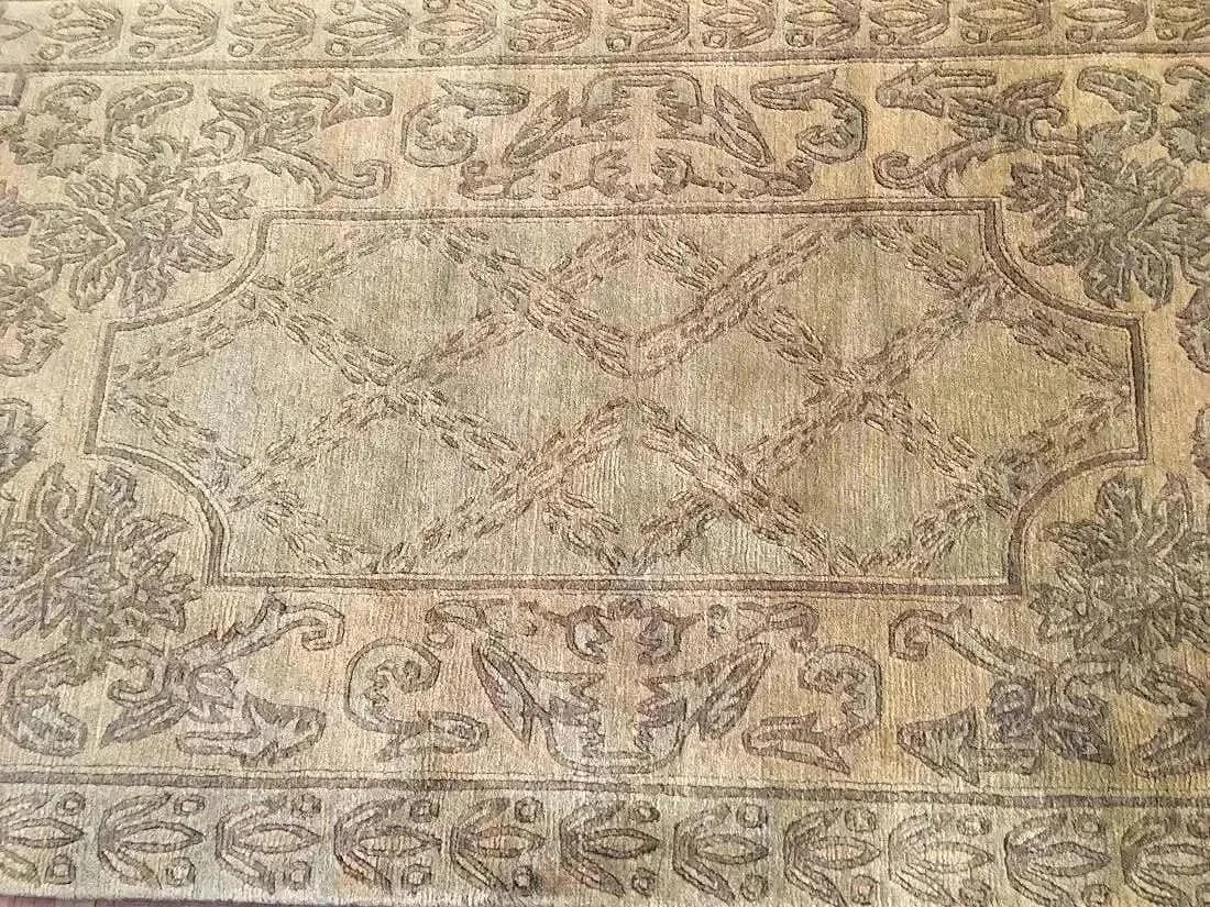 A contemporary Nepalese hand woven wool rug: A contemporary Nepalese hand woven wool rug measuring 4 feet wide by 5 feet 10 inches long