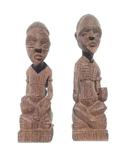 Pair of African Wood carving statues: Pair of African Wood carving statues measuring 12 1/2 inches tall.