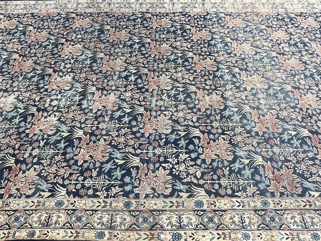 Antique Persian Kerman palace size hand woven rug: Antique Persian Kerman palace size hand woven rug measuring 8 feet 11 inches wide by 19 feet 10 inches long. A finely woven wool Persian kerman rug signed by the master weaver. A reduced in width anti