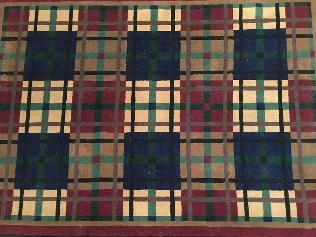 A contemporary Nepalese wool rug: A contemporary Nepalese hand woven wool rug measuring 4 feet wide by 5 feet 10 inches long