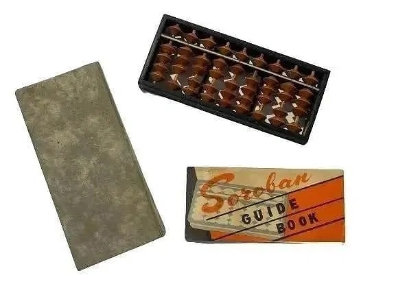 A Japanese Soroban Abacus calculator: A vintage Japanese Soroban Abacus calculator. Abacus calculator Wood Bead 9 Row Soroban Abacus & Box with instruction booklet.