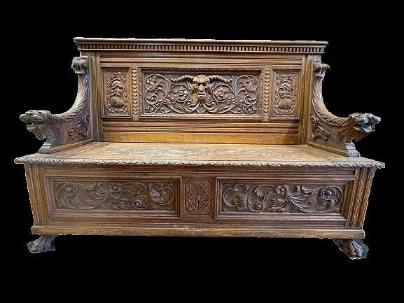 Antique European Gothic hand carved oak bench: Antique European Gothic hand carved oak bench with a lift seat for trunk & storage. A finely and heavily carved oak bench with unique figures.The seat truck has three brass hinges stamped:HODGES PATEN