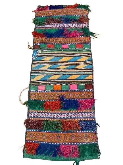 A Balouch hand woven Saddle bag: An old Afghan Balouch hand woven Saddle bag measuring 39 inches long by 14 inches long.