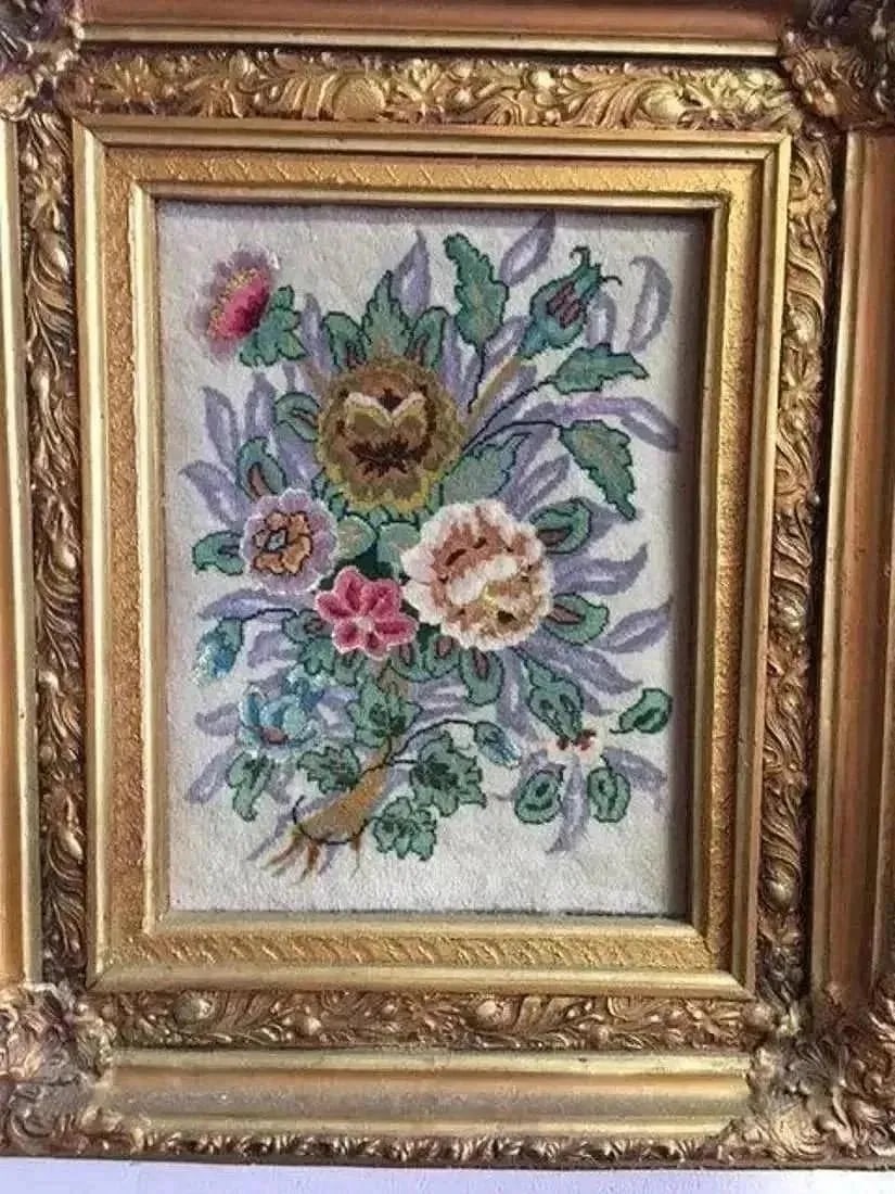 A Persian TABRIZ pictorial rug in frame: A fine Persian TABRIZ floral pictorial handwoven rug Framed in a nice gilded wooden frame.Size of the Rug: 12" by 15"Frame Size: 21" by 25"Design: Floral Material: Wool & silk highlights on cotton fou