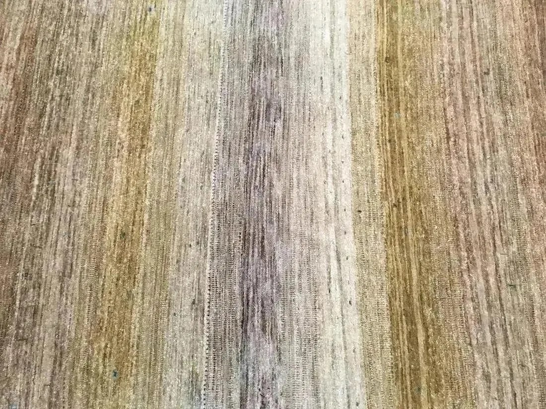 A Handwoven Tibetan Gabbeh Rug: A Handwoven Tibetan Gabbeh wool Rug measuring 3 feet 10 inches wide by 5 feet 8 inches long.