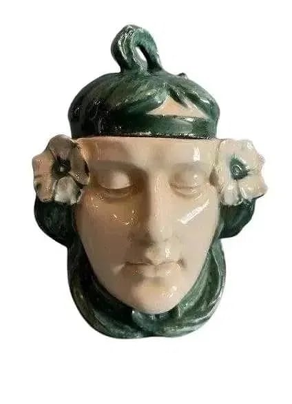 Female head figure glazed Austrian art nouveau: A Female head glazed Austrian pottery jar measuring 6 inches tall. Possibly an art nouveau period.