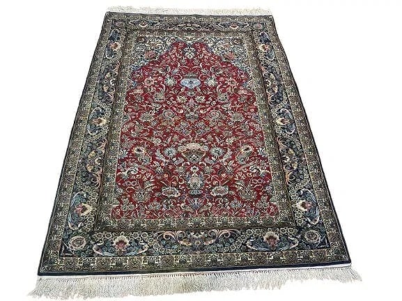 A Persian Isfahan handwoven fine silk & wool rug: A Persian Isfahan handwoven fine silk & wool rug measuring 5 feet 4 inches wide 7 feet 6 inches long. A finely handwoven genuine Persian Isfahan rug with silk foundation and wool pile. A unique and co