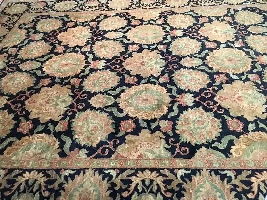 A hand woven Indian Agra Mahal wool rug: A hand woven Indian Agra Mahal wool rug. Measuring 9 ft 2 inches wide by 12 ft 4 inches long.