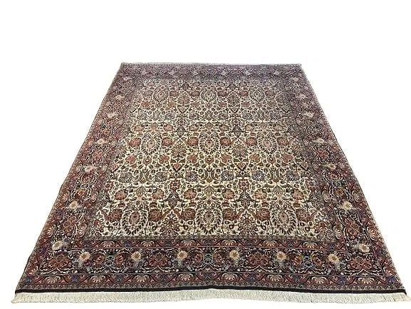 A Persian Bijar hand woven wool rug: A Persian Bijar hand woven wool rug measuring 6 feet 8 inches by 8 feet 4 inches long. A finely woven Genuine Persian Kurdish Bijar wool rug. A highly intricate floral all over design.