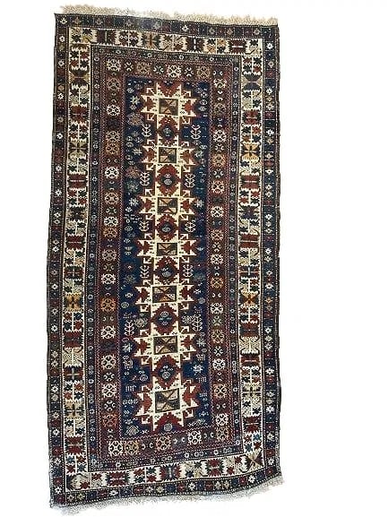 Antique Caucasian Shirvan Lesghi Star hand woven rug: Antique Caucasian Shirvan Lesghi Star hand woven rug. Antique Lesghi star Shirvan wool on wool hand woven rug with its original fringes.A row of Seven Star Leghi pattern flanked with many tribal symbo