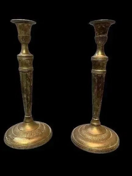 A Pair of Indian Plated Candlesticks: A Pair of Indian Plated Candlesticks. Each standing 12 inches tall.