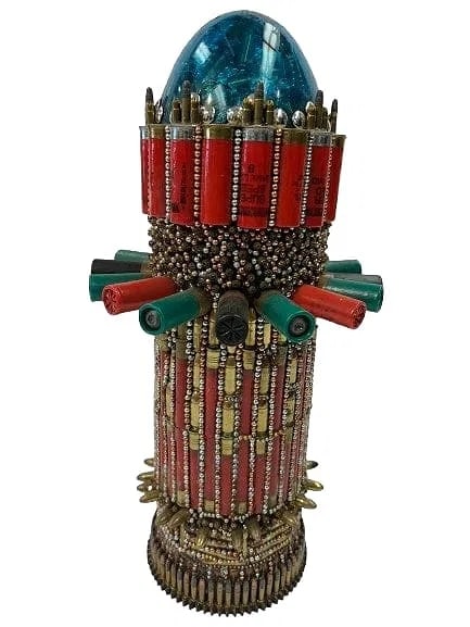 A Tank Bullet assemblage Art sculpture of military 105 MM shell: A Tank Bullet Assemblage Sculpture of military art standing 19 inches tall.Made up of 105 Millimeter shell covered , filled and decorated with many different size bullets and high speed Shot gun