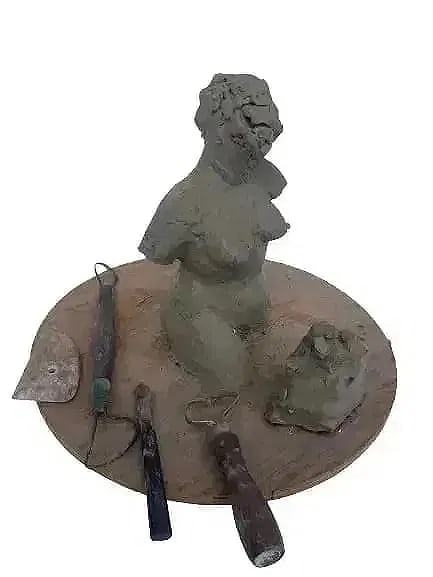 Clay Female bust clay with pottery carving tools: Clay Female bust with pottery carving tools on a banding plywood wheel. A unique unfished work directly from the studio of Mr. Hudgens of winter. Clay still remains soft. local pick up is highly