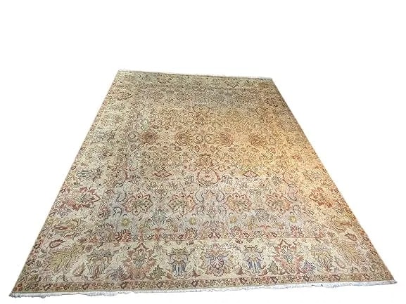 An Indian Ushak Agra large room size rug: An Indian Ushak Agra large room size rug measuring 10 feet wide by 12 feet 3 inches long. A genuine handwoven wool rug with an all over floral & cloud band Ushak Agra design.
