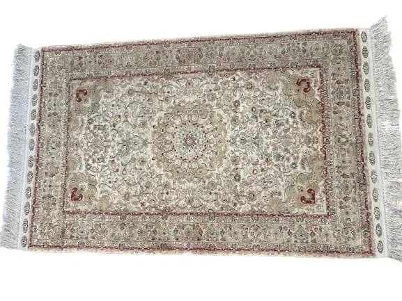 A pure SILK hand woven rug: A pure SILK hand woven rug measuring 3 feet 2 inches wide by 5 feet 1 inch long. A pure Silk on Silk Hereke design hand woven rug.Please read the condition report below before placing your bid. All lo