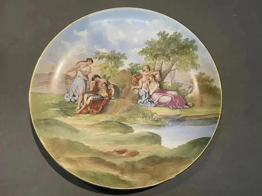 Austrian Porcelain charger plate Signed: A fine hand painted porcelain charger Signed Kaufmann. Possibly after Angelica Kauffman's Paintings Venus and Mars + Cupid Binding Aglaia of Austria. dimensions : 13" 1/2 inches in diameter.