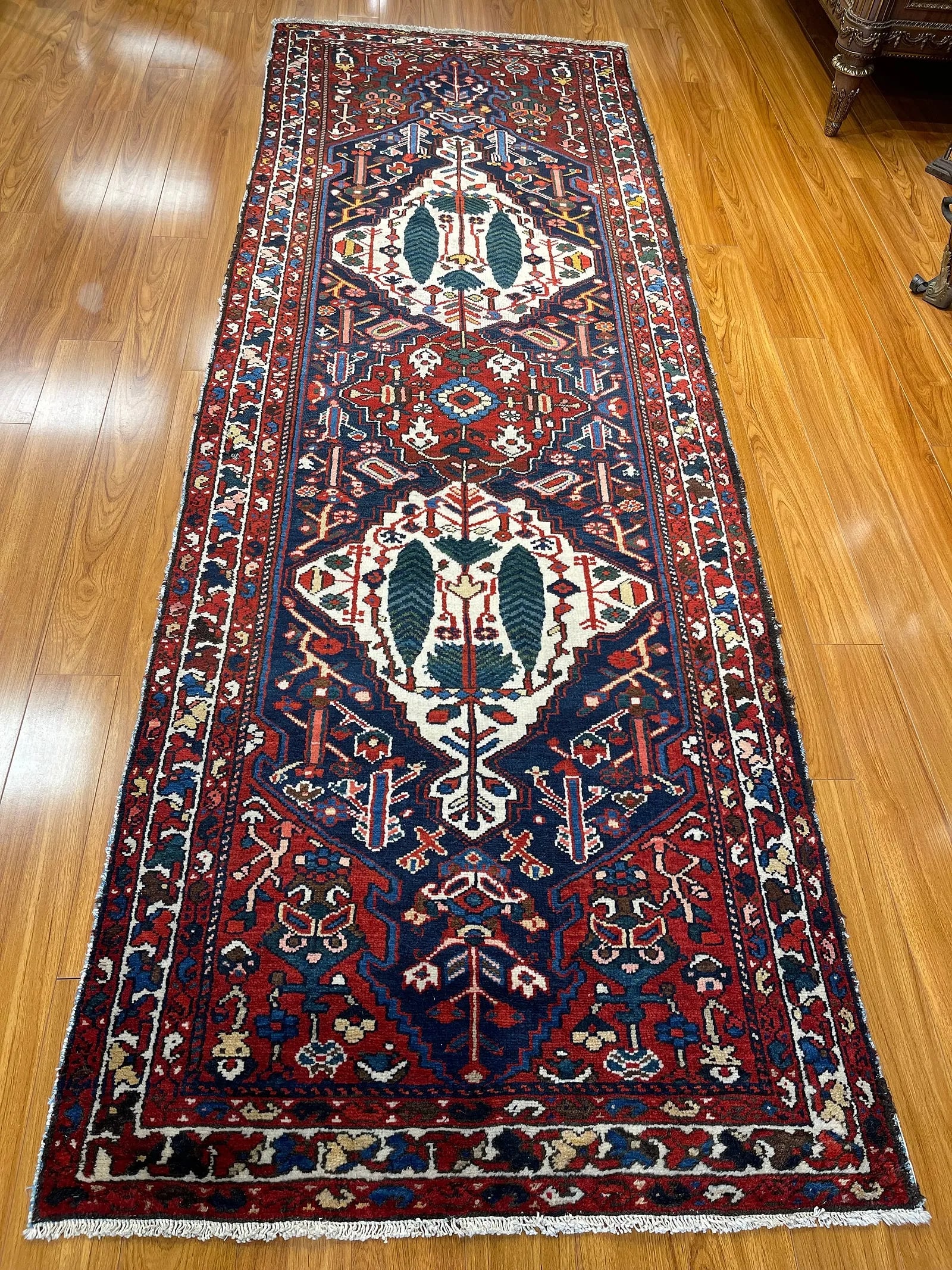 Antique Persian Bakhtiari handwoven tribal runner: Antique Persian Bakhtiari runner measuring 3 feet 6 inches wide by 10 feet 3 inches long. A Tribal Cyprus tree design wool on cotton hand knotted Persian Bakhtiari long runner. Please read the conditi