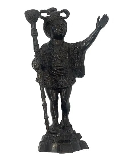 A French Bronze Blackamoor D'ore Candle holder statue: A French Bronze Blackamoor D'ore Candle holder statue standing 15 inches tall. A solid bronze decorative statue.