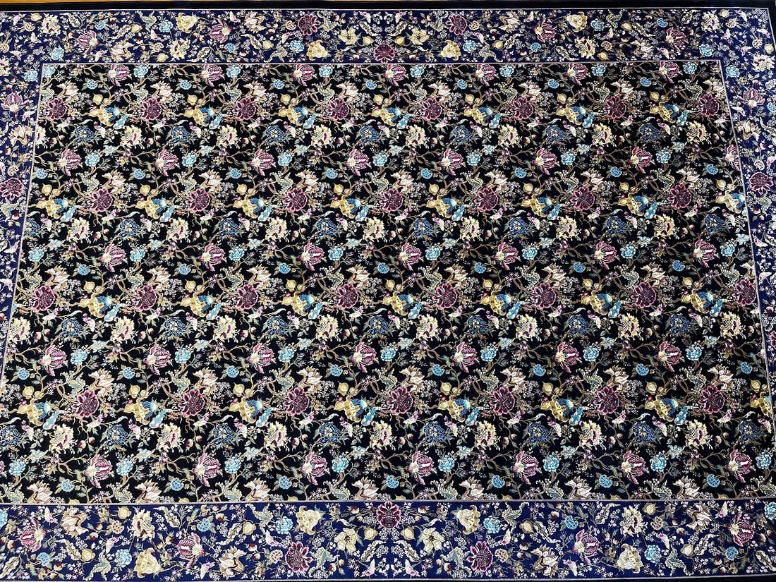 A Persian Silk Qum machine woven hand fringed rug
