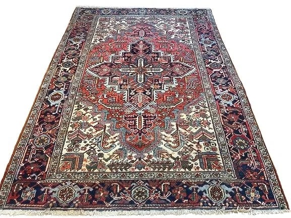 Antique Persian Heriz hand woven rug 6.3 by 8.6: Antique Persian Heriz hand woven wool rug measuring 6 ft 3 inches wide by 8 ft 6 inches long. A wool genuine Persian Heriz rug from the Northwest region of Persia. Unique geometric design on a rust fi
