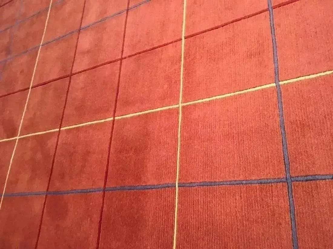 A handwoven Tibetan Contemporary wool rug: A hand woven Tibetan Contemporary wool rug Measuring 8 ft 2 inches wide by 11 ft 2 inches long.