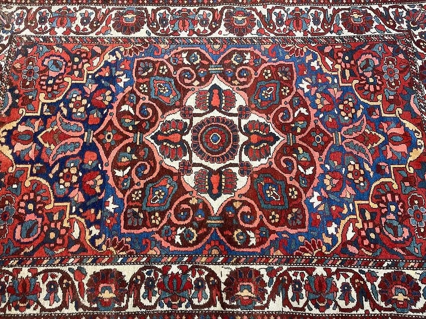 Antique Persian Bakhtiari tribal scatter rug: Antique Persian Bakhtiari measuring 4 feet 3 inches wide by 6 feet 6 inches long. A Tribal center medallion floral design wool on cotton hand knotted Persian Bakhtiari long runner. Please read the con