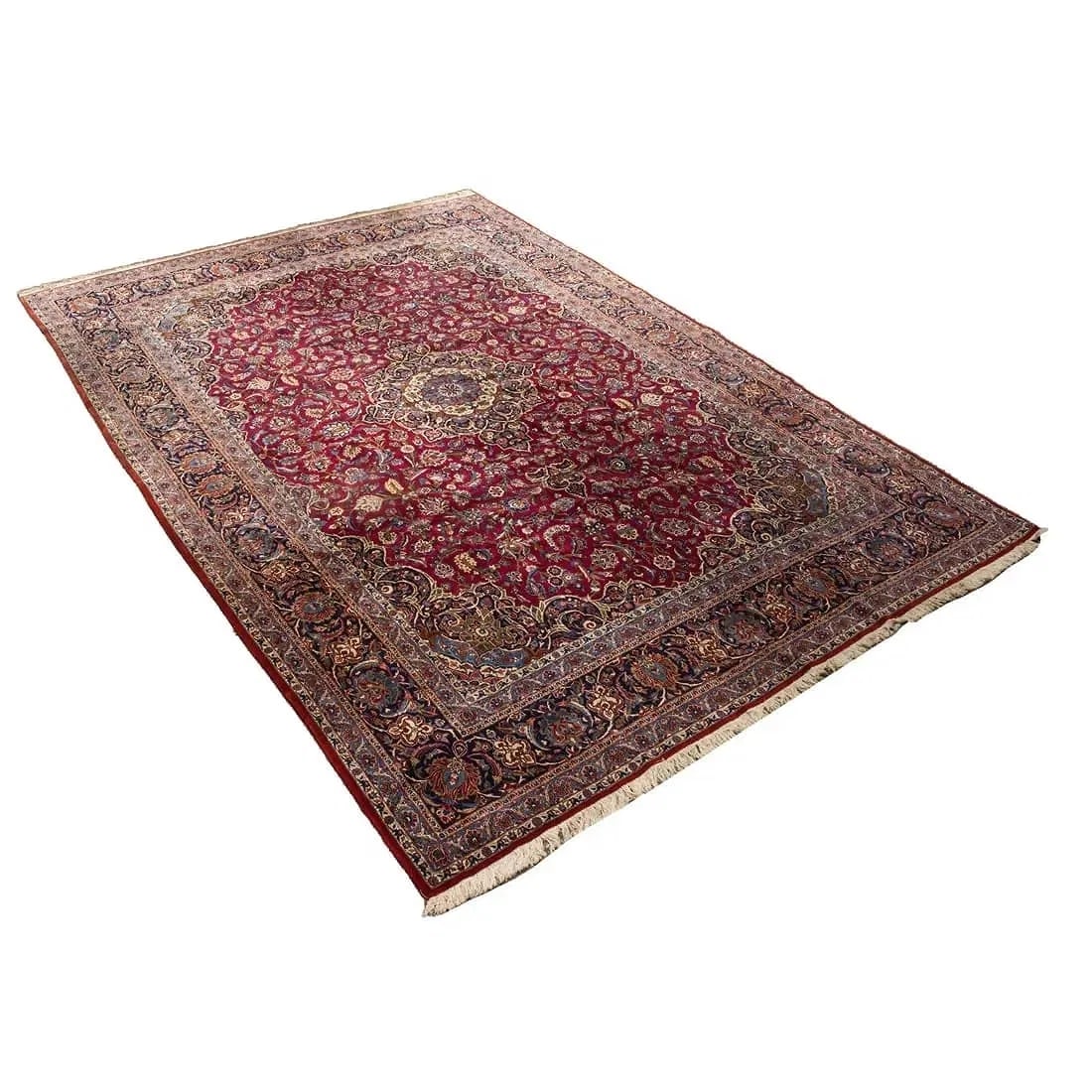 A fine Persian Kashan large scale handwoven Rug: A fine Persian Kashan large scale handwoven Rug measuring 10 feet 6 inches wide by 14 feet 10 inches long. A finely woven pure wool Persian Kashan with a Burgundy field with floral pattern.
