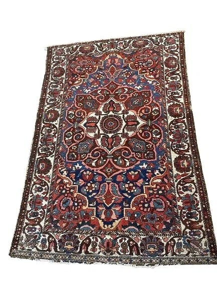 Antique Persian Bakhtiari Handwoven Rug: Antique Persian Bakhtiari Handwoven Rug measuring 4 feet 4 inches wide by 6 feet 7 inches long. A colorful tribal wool Persian Baktriari scatter rug.