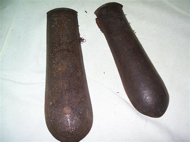 Important set of ANTIQUE PERSIAN ELBOW GUARD BAZU BAND: Important set of TWO ANTIQUE PERSIAN ELBOW GUARD BAZU BANDS.CIRCA 1850'Sone with Gold high lights measuring 12" 3/8 inches x 4" inches.One with hand hammered floral pattern measuring 11" 1/2 by 3" 1/2