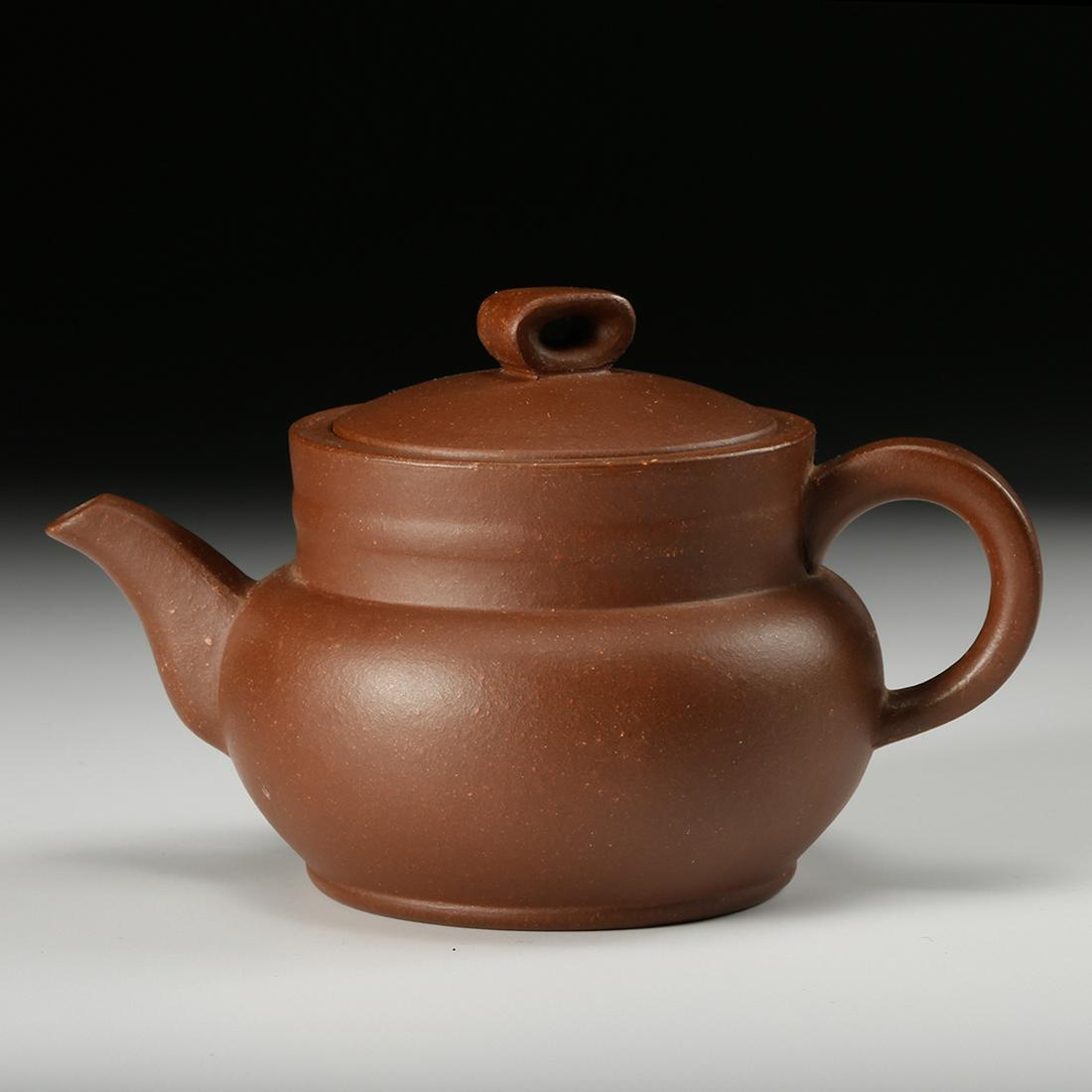 CHINESE YIXING ZISHA TEA POT: Length: 4.7 inches. Width: 3.1 inches. Height: 2.8 inches. Length: 12cm Width: 8cm Height: 7.2cm. Provenance: From the collections of Mr. Tsai estates from Pittsburg, PA.