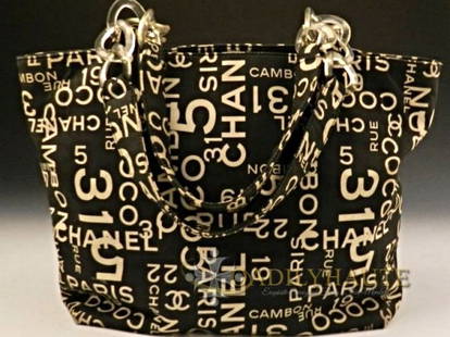 CHANEL COCO No.5 RUE 31 TOTE NEVERFULL BAG: CHIC AND TIMELESS STYLE OF A CHANEL BLACK AND CREAM TOTE BAG, FEATURING A CANVAS BODY WITH PRINT OF CHANEL 31 RUE CAMBON, CHANELS FLAGSHIP LOCATION IN PARIS ACROSS THE BAG. FLAT SHOULDER STRAP WITH