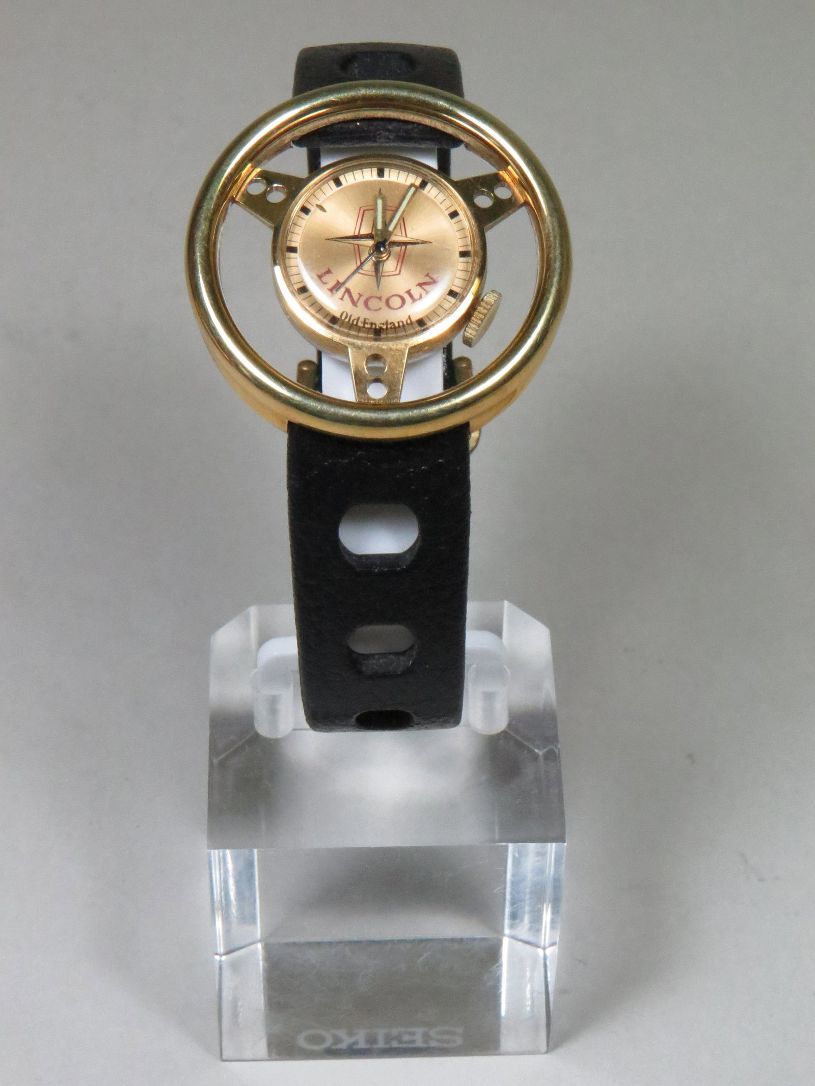 AUTOMOTIVE WRISTWATCH Steering Wheel, automotive themed: AUTOMOTIVE WRISTWATCHESFrom a private, automotive themed watch collection.Lincoln steering wheel by Old England. Circa 1968-1970. Swiss Made, Mechanical - manual wind. A very rare timepiece in the Old