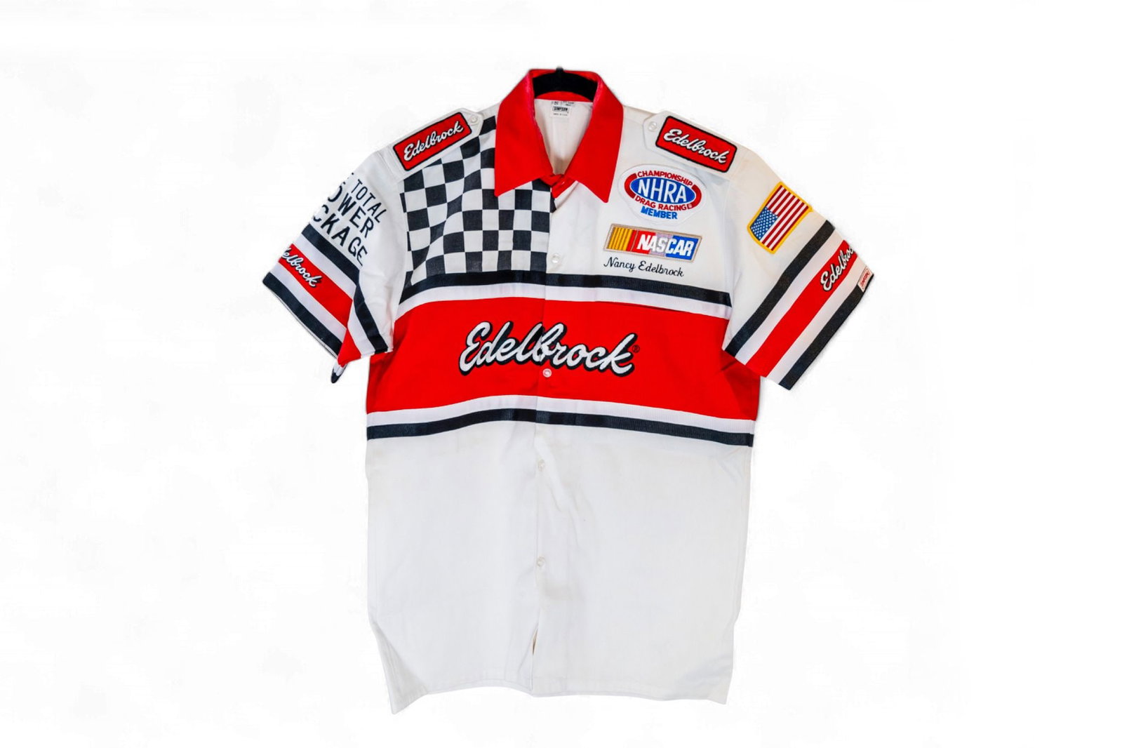 white Edelbrock shirt was 'Nancy Edelbrock' on the left chest with other sponsorship logos, woman's: white Edelbrock shirt was 'Nancy Edelbrock' on the left chest with other sponsorship logos, woman's size medium Nancy Edelbrock wasÂ referred to as "the Real Boss" by Vic and played an essential role