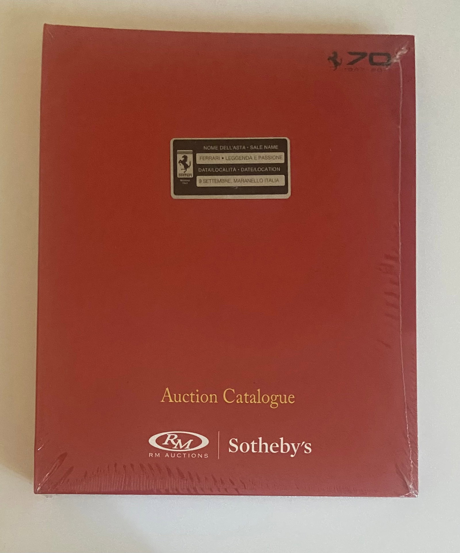 Ferrari Legende E Passione Maranello Rare SEALED AUCTION CATALOG RM SOTHEBYS: Ferrari Legende E Passione Maranello Rare SEALED AUCTION CATALOG RM SOTHEBYS, BOUND NEVER OPENED SEALED IN PLASTIC COMES WITH METAL CHASSIS TAG ON THE COVER OF THE BINDER