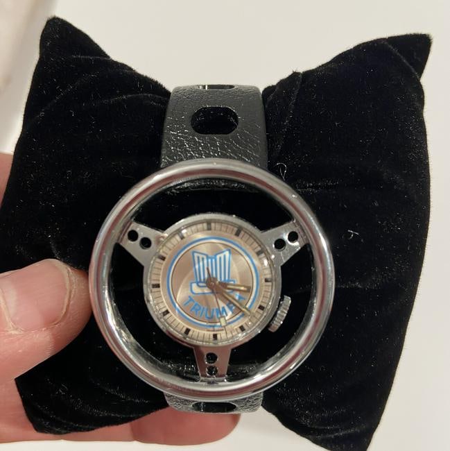 Triumph Steering wheel watch 1960s: Triumph Steering wheel watch 1960s Super rare!!! has been restored and serviced in a newer box, a similar one sold for $1900 at Juliens Auction a few months ago.