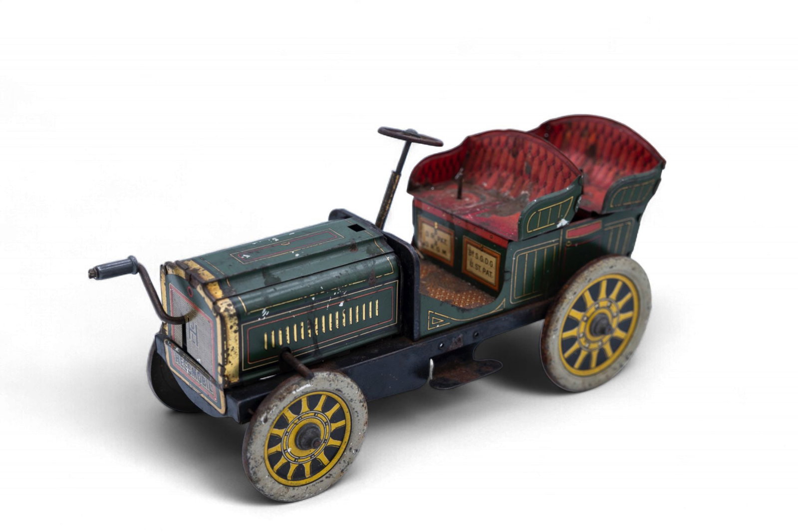 A Hessmobil tinplate car, German, circa 1908, green lithographed tinplate construction, flywheel (1 of 1)