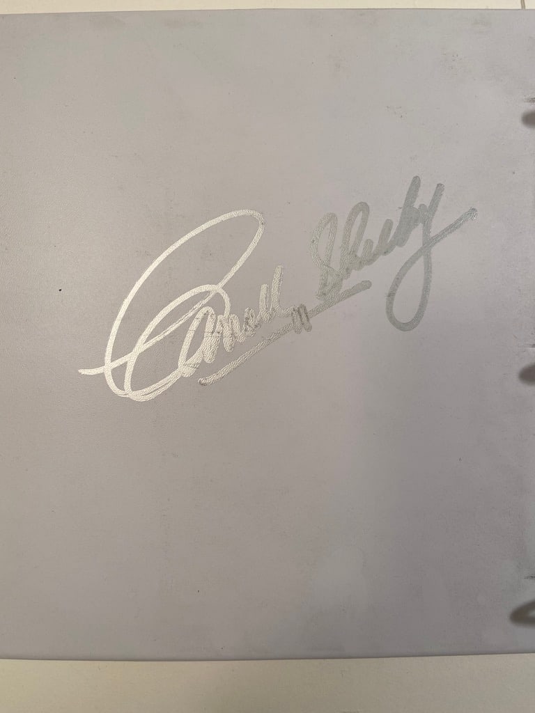 Carroll Shelby Oversize Signed Shelby Lancer Service Manual: Very rare Oversize Performance Vehicle Service Manuel for the Dodge Lancer put out by Shelby Automobiles, Inc. Super large and bold signature inside the front cover of the binder. As signatures go