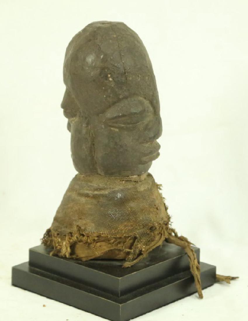 BURA TERRACOTTA GRAVE MARKER & BUST: LEFT ITEM: BURA TERRACOTTA GRAVE MARKER. ORIGIN: NIGER/BURKAN FASO. RIGHT ITEM: C. 20TH CENTURY JANUFORM SHRINE FETISH BUST. ORIGIN: DEMOCRATIC REPUBLIC OF CONGO. Height: 8 & 10 in. by Width: 4 & 5 in