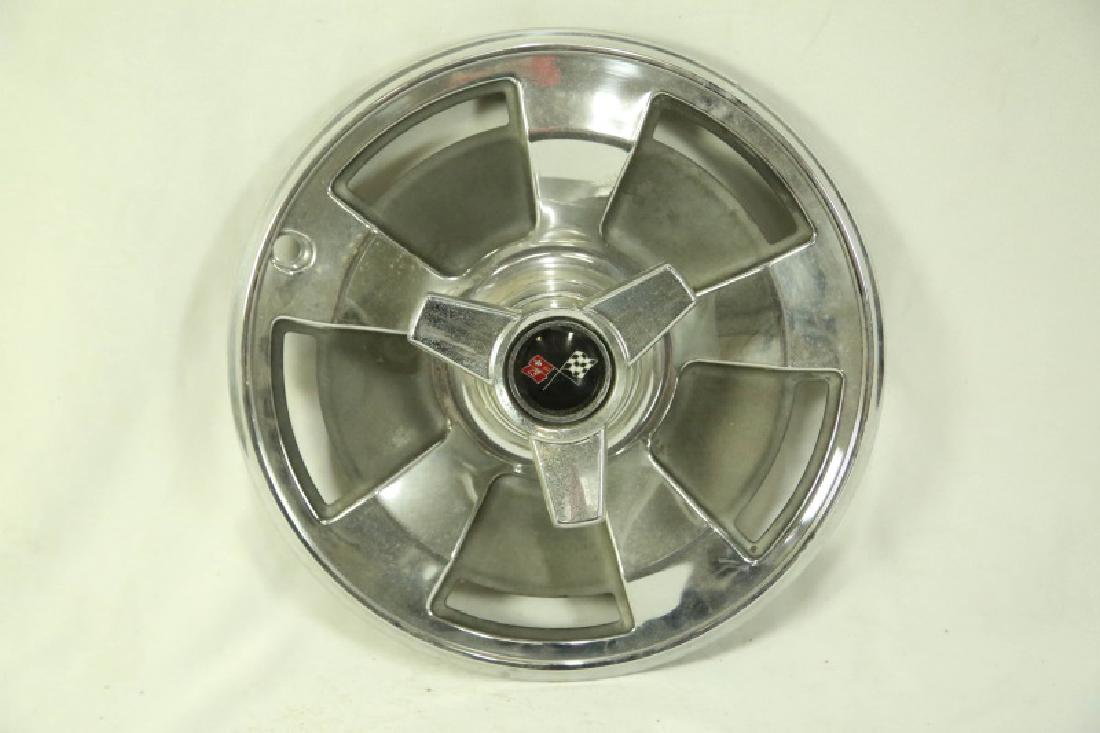 SET OF FOUR VINTAGE CORVETTE HUBCAPS: SET OF FOUR VINTAGE CORVETTE HUBCAPS. Height: 15 in. by Width: 15 in. by Depth: 3 in.
