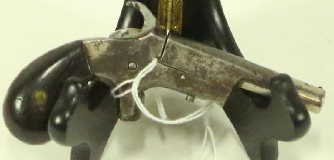 UNION DERRINGER .22: UNION DERRINGER .22 LADIES MUFF PISTOL CA 1880 (ANTIQUE FIREARM) CALIBER: .22 RIMFIRE SERIAL: NONE