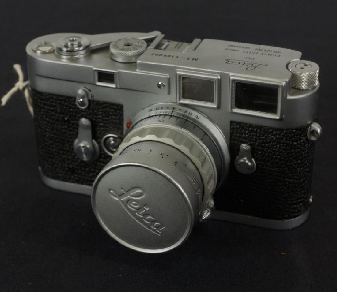 LEICA CAMERA & LEATHER CAMERA BAG: LEICA CAMERA & LEATHER CAMERA BAG. Height: 7 in. by Width: 10 in. by Depth: 7 in.