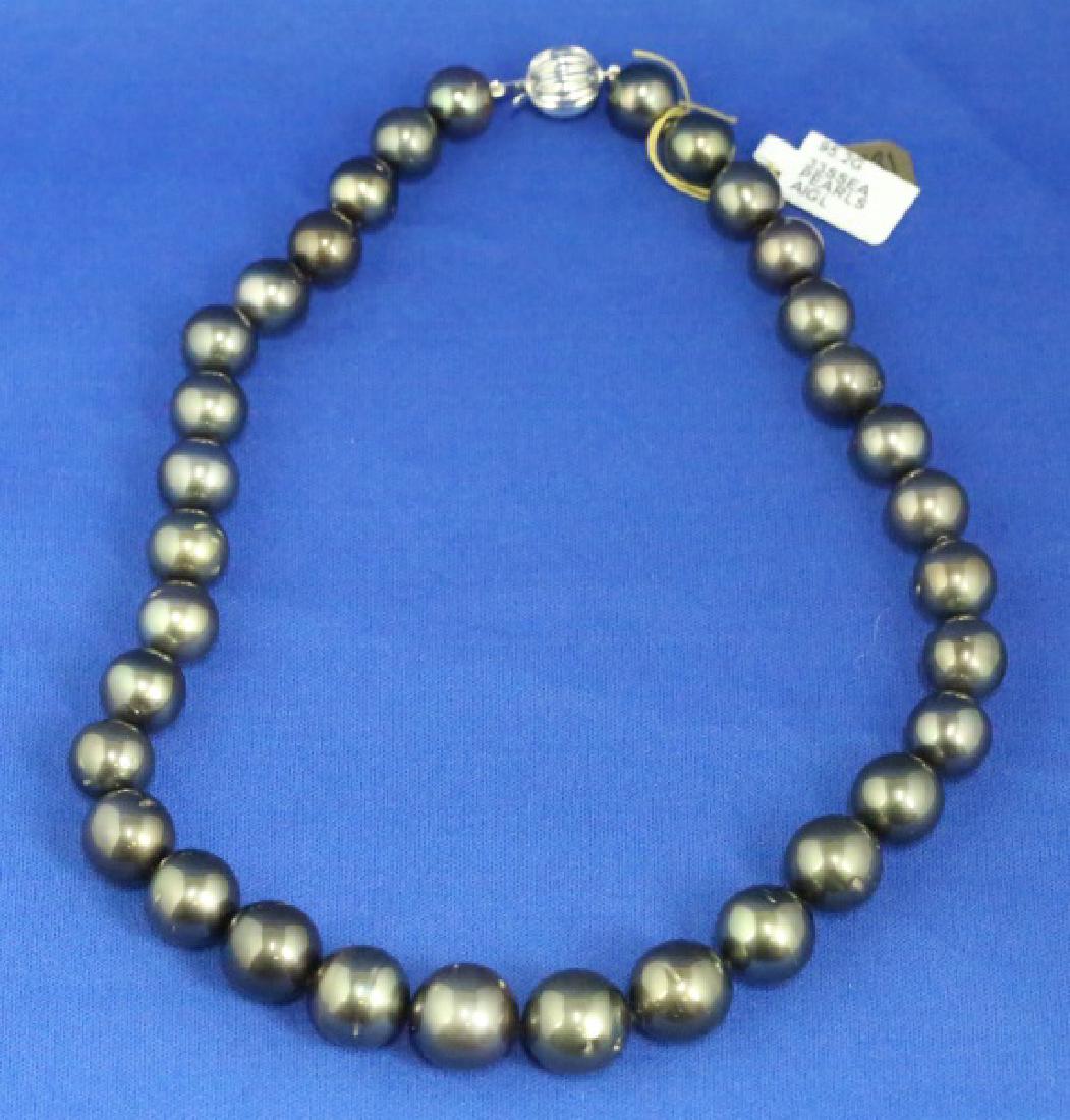 GRADUATED SINGLE STRAND TAHITIAN PEARL NECKLACE: ONE GRADUATED SINGLE STRAND TAHITIAN PEARL NECKLACE. 33=11-15MM TAHITIAN PEARLS. 95.2 GRAMS T.W. 14KT WHITE GOLD PLUNGER STYLE BEAD CLASP. 17.5".